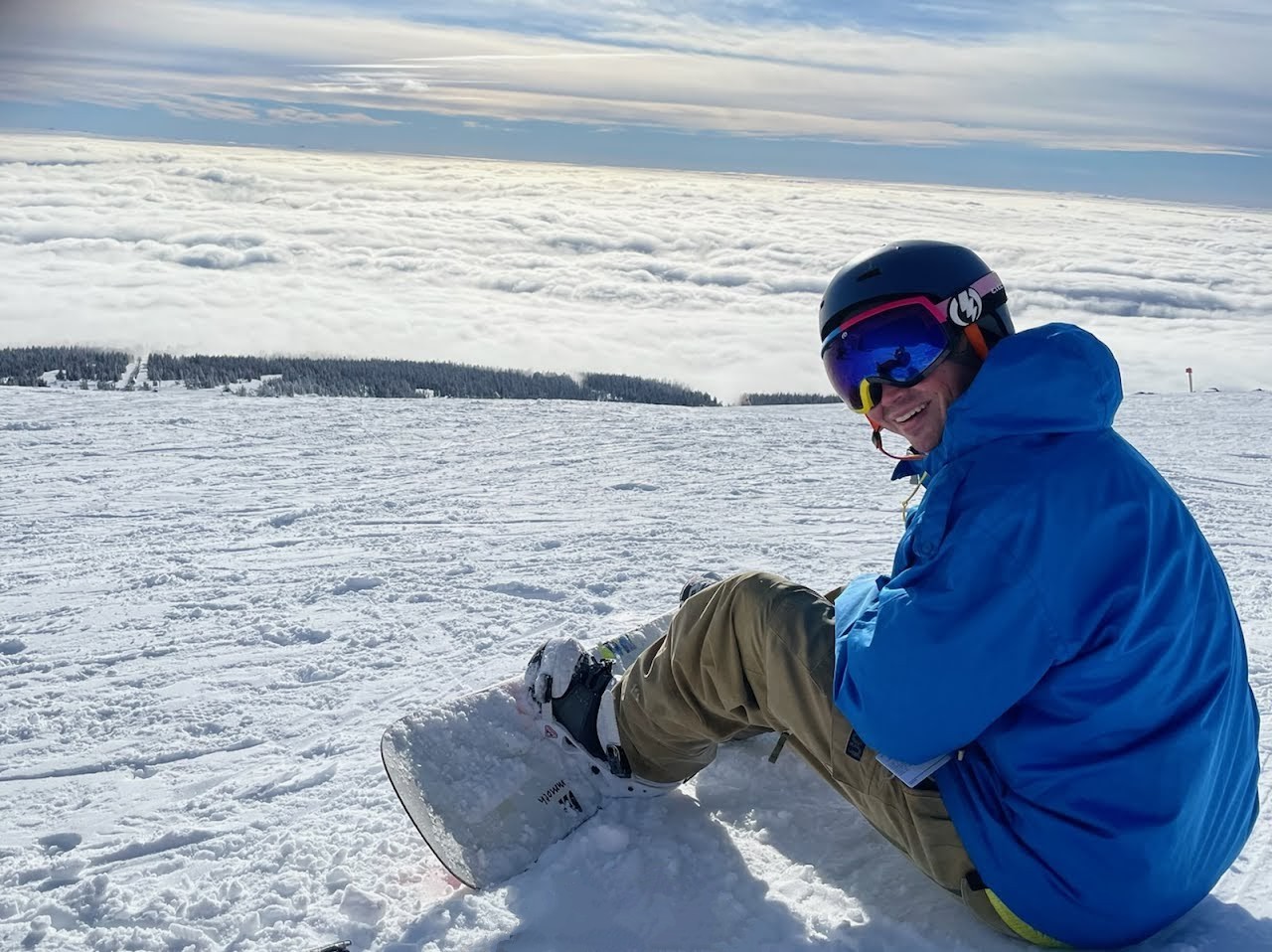 Above the clouds on a snowboard